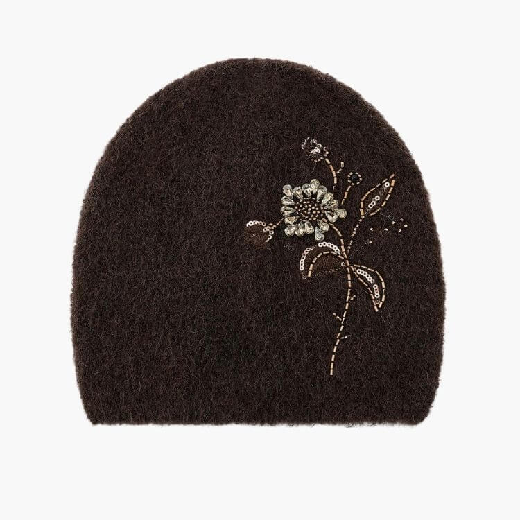 A knit beanie featuring intricate beaded floral patterns.