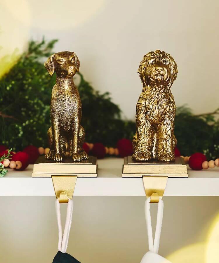 Metal dog-shaped stocking holder.